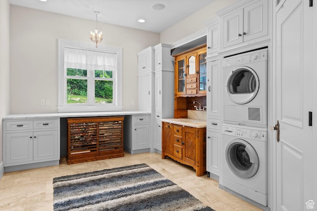 3291 E 1300 N, Layton, UT 84040 - laundry area featuring stacked washer and clothes dryer, a chandelier, and recessed lighting