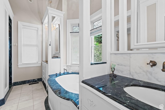 3291 E 1300 N, Layton, UT 84040 - full bath featuring a garden tub, vanity, and baseboards