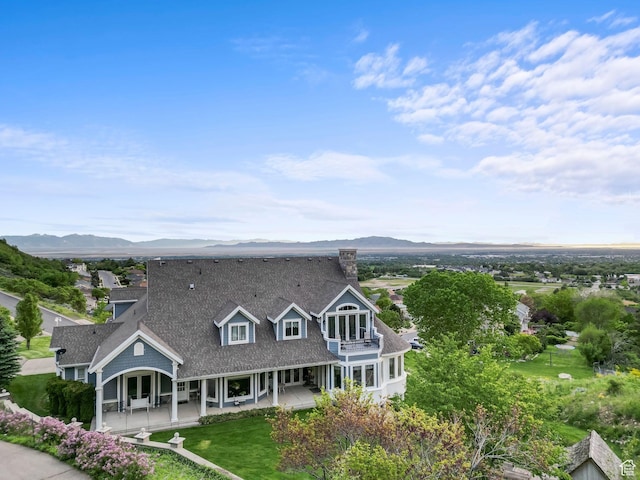 3291 E 1300 N, Layton, UT 84040 - rear view of house with a balcony, a mountain view, and a patio