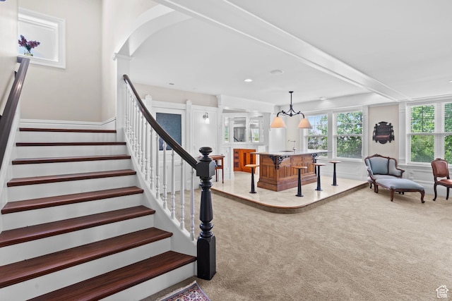 3291 E 1300 N, Layton, UT 84040 - stairs with carpet, a wainscoted wall, and arched walkways