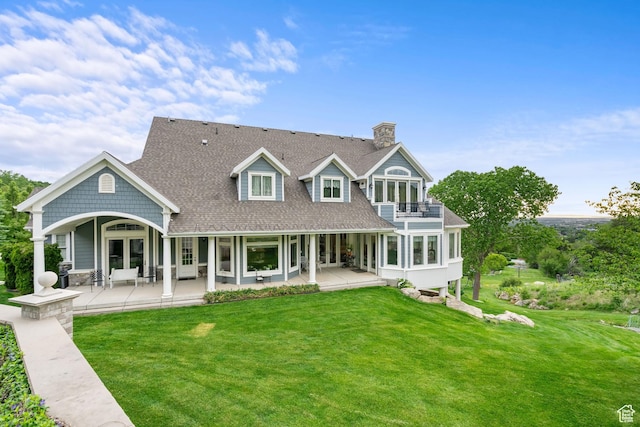 3291 E 1300 N, Layton, UT 84040 - back of property featuring a balcony, french doors, a lawn, a chimney, and roof with shingles