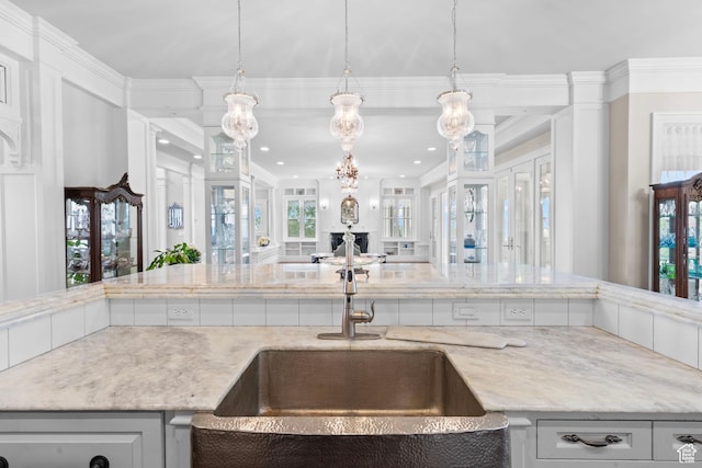 3291 E 1300 N, Layton, UT 84040 - kitchen with a sink, crown molding, open floor plan, light stone counters, and recessed lighting