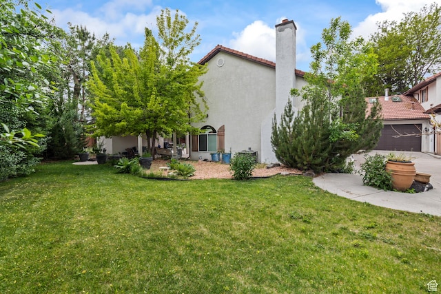 154 E 950 N, Glenwood, UT 84730 - view of green lawn with an attached garage