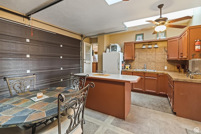 154 E 950 N, Glenwood, UT 84730 - kitchen with freestanding refrigerator, a sink, tasteful backsplash, light countertops, and ceiling fan