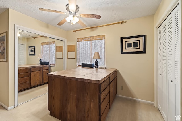 154 E 950 N, Glenwood, UT 84730 - home office with a textured ceiling, a ceiling fan, light colored carpet, and baseboards