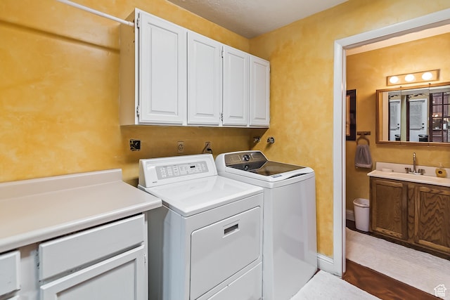 154 E 950 N, Glenwood, UT 84730 - washroom featuring cabinet space, independent washer and dryer, and dark wood-style flooring