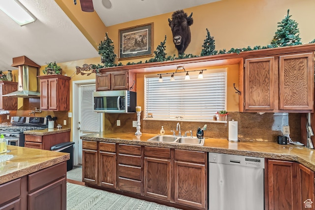 154 E 950 N, Glenwood, UT 84730 - kitchen with stainless steel appliances, a sink, island range hood, decorative backsplash, and brown cabinetry
