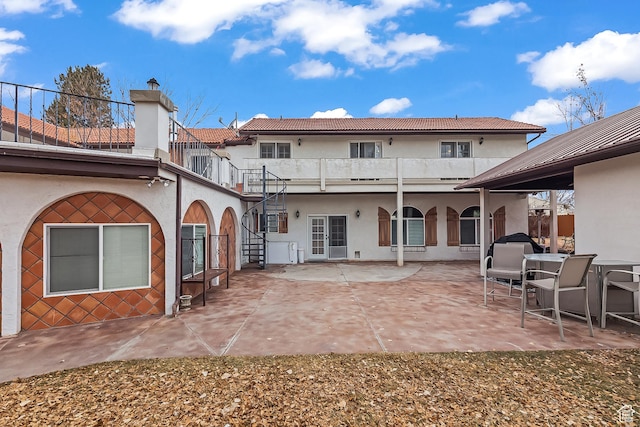154 E 950 N, Glenwood, UT 84730 - rear view of property with stucco siding, a patio, a tiled roof, and stairway