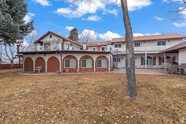 154 E 950 N, Glenwood, UT 84730 - rear view of property featuring a balcony, a patio area, and stucco siding