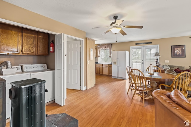 154 E 950 N, Glenwood, UT 84730 - dining space with washing machine and dryer, a ceiling fan, and light wood-style flooring