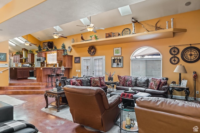 154 E 950 N, Glenwood, UT 84730 - living area featuring concrete flooring, a ceiling fan, and a skylight