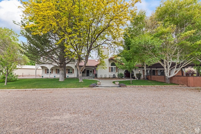 154 E 950 N, Glenwood, UT 84730 - view of front of house featuring stucco siding and a front lawn