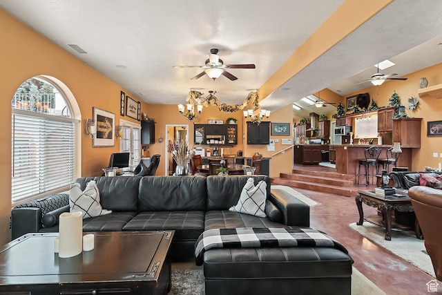 154 E 950 N, Glenwood, UT 84730 - living area featuring a ceiling fan, a chandelier, and finished concrete flooring