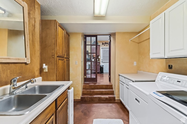 154 E 950 N, Glenwood, UT 84730 - washroom with cabinet space, separate washer and dryer, and a textured ceiling