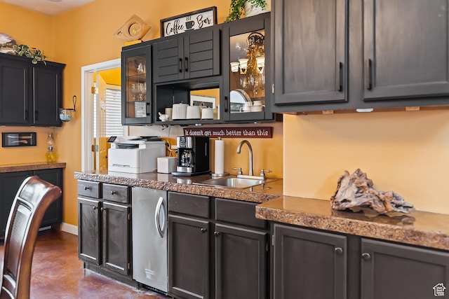 154 E 950 N, Glenwood, UT 84730 - kitchen featuring a sink, glass insert cabinets, finished concrete floors, and dark countertops