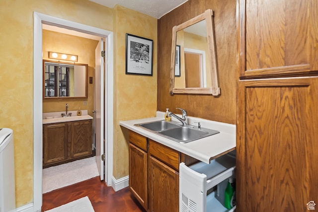 154 E 950 N, Glenwood, UT 84730 - bathroom with wood finished floors, two vanities, baseboards, and toilet