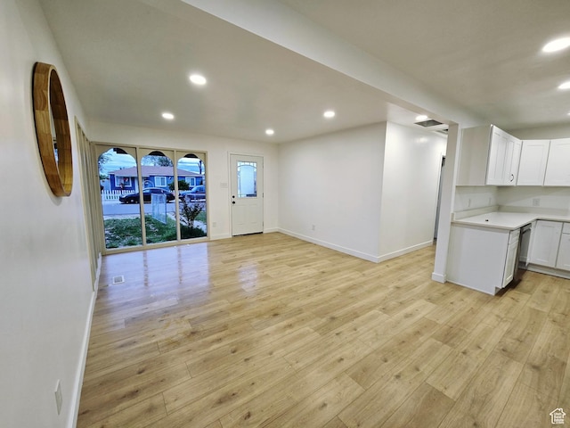 4505 W 5335 S, Kearns, UT 84118 - unfurnished living room featuring baseboards, recessed lighting, and light wood-style floors