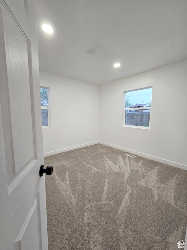 4505 W 5335 S, Kearns, UT 84118 - unfurnished room featuring carpet floors, baseboards, recessed lighting, and healthy amount of natural light