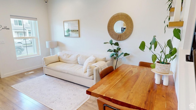 9367 N Vernham Way E, Eagle Mountain, UT 84005 - living area featuring light wood finished floors and baseboards