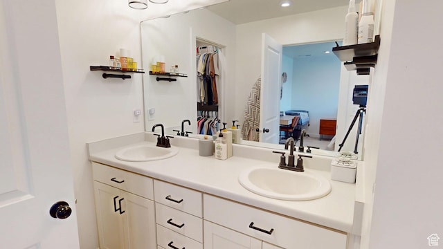 9367 N Vernham Way E, Eagle Mountain, UT 84005 - ensuite bathroom with double vanity and recessed lighting
