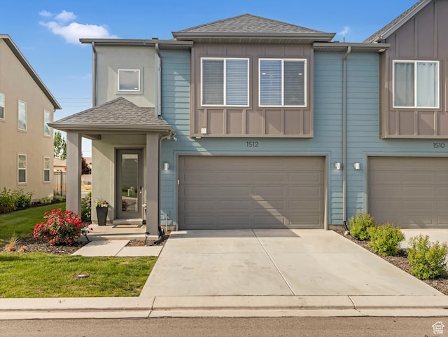 1512 W Fiore St, Farmington, UT 84025 - view of front of house with a garage, concrete driveway, roof with shingles, and board and batten siding