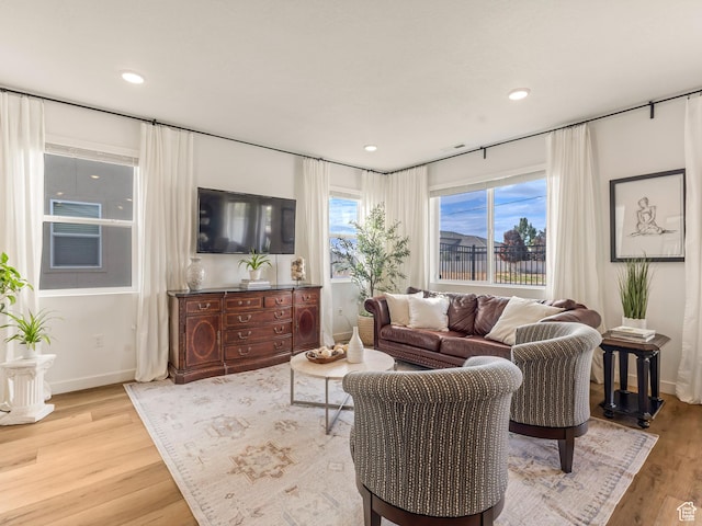 1512 W Fiore St, Farmington, UT 84025 - living room with light wood-style flooring, baseboards, and recessed lighting