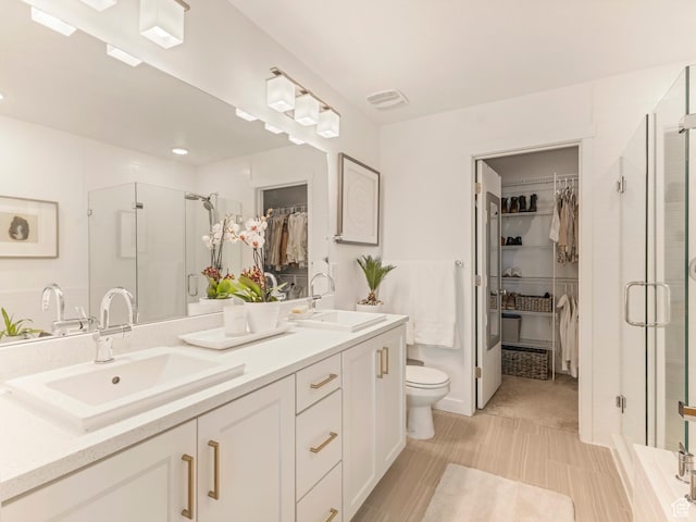 1512 W Fiore St, Farmington, UT 84025 - full bath with a walk in closet, double vanity, a shower stall, and toilet