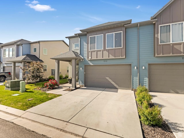 1512 W Fiore St, Farmington, UT 84025 - townhome / multi-family property featuring board and batten siding, a garage, and driveway