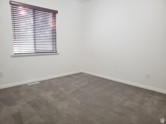 4142 S Davencrest Ln, Taylorsville, UT 84129 - spare room featuring dark colored carpet and baseboards