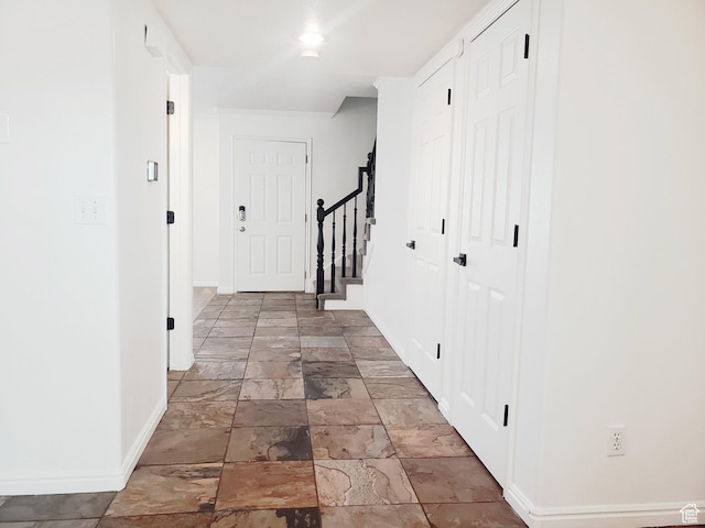 4142 S Davencrest Ln, Taylorsville, UT 84129 - corridor featuring baseboards, stone tile floors, and stairs