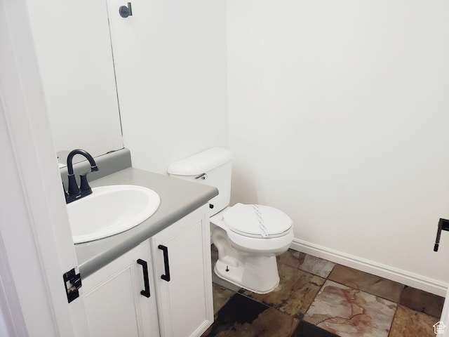 4142 S Davencrest Ln, Taylorsville, UT 84129 - half bath featuring vanity, toilet, and baseboards