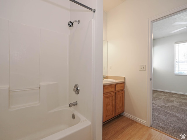 130 Bamberger Rd, North Salt Lake, UT 84054 - bathroom featuring vanity, shower / bath combination, wood finished floors, and baseboards