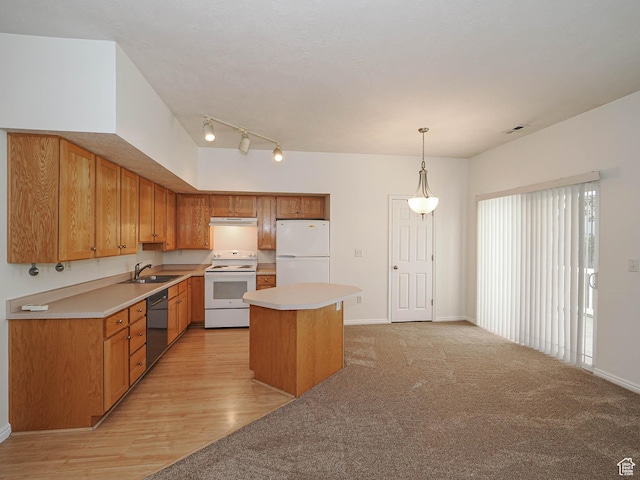 130 Bamberger Rd, North Salt Lake, UT 84054 - kitchen with white appliances, light countertops, a sink, and a center island