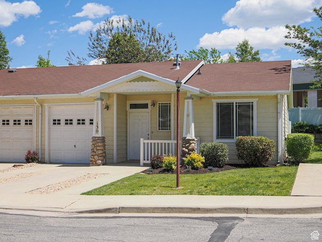130 Bamberger Rd, North Salt Lake, UT 84054 - view of front of property featuring a garage, covered porch, a front lawn, and a shingled roof