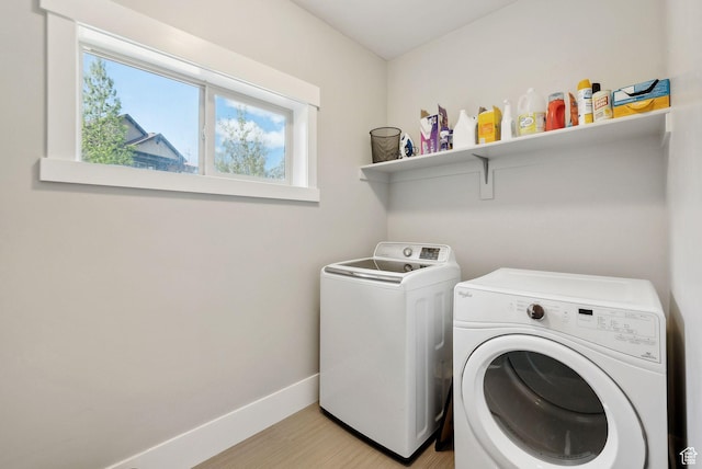 1757 E Longview Dr Unit 87, Hideout, UT 84036 - laundry area with washer and clothes dryer, healthy amount of natural light, baseboards, and light wood finished floors