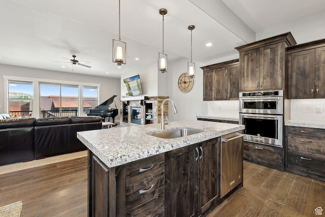 1757 E Longview Dr Unit 87, Hideout, UT 84036 - kitchen featuring a sink, appliances with stainless steel finishes, dark wood finished floors, dark brown cabinets, and ceiling fan