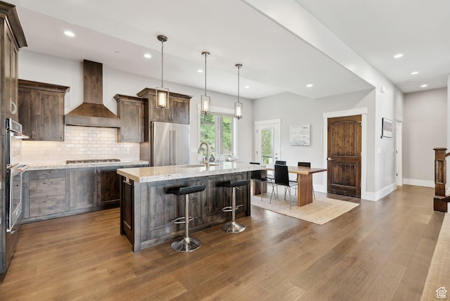 1757 E Longview Dr Unit 87, Hideout, UT 84036 - kitchen featuring custom exhaust hood, appliances with stainless steel finishes, a sink, dark wood finished floors, and tasteful backsplash