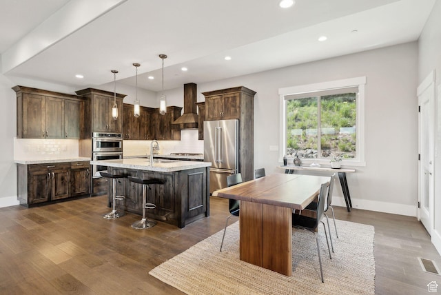 1757 E Longview Dr Unit 87, Hideout, UT 84036 - kitchen featuring appliances with stainless steel finishes, a kitchen island with sink, recessed lighting, a sink, and tasteful backsplash