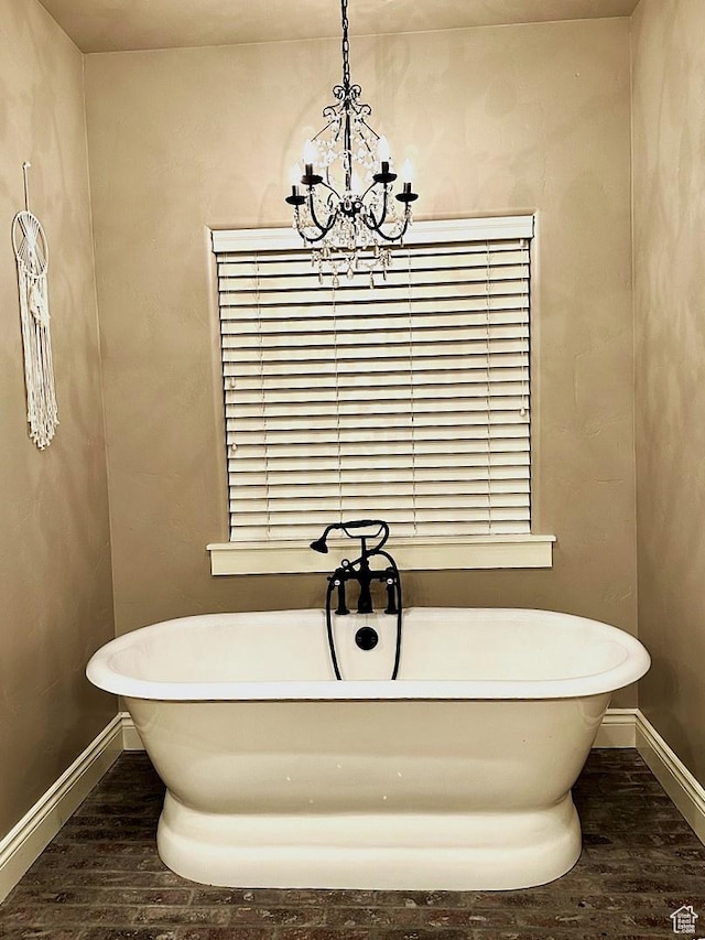 1471 N 3500 E, Ballard, UT 84066 - full bath with wood finished floors, a chandelier, baseboards, and a soaking tub