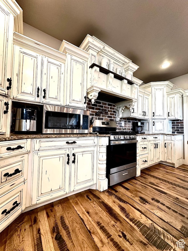 1471 N 3500 E, Ballard, UT 84066 - kitchen with stainless steel appliances, backsplash, dark wood-type flooring, open shelves, and cream cabinetry