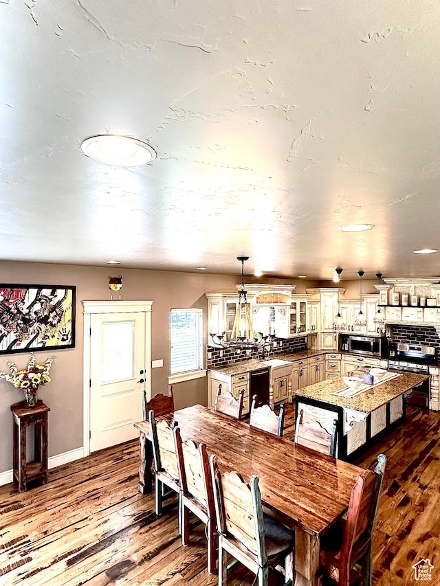 1471 N 3500 E, Ballard, UT 84066 - dining room featuring wood finished floors, a chandelier, and baseboards