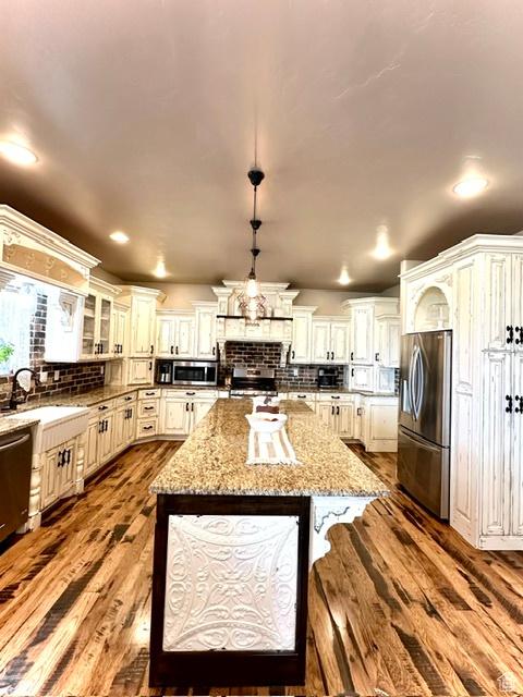 1471 N 3500 E, Ballard, UT 84066 - kitchen with appliances with stainless steel finishes, dark wood-style flooring, a sink, tasteful backsplash, and recessed lighting