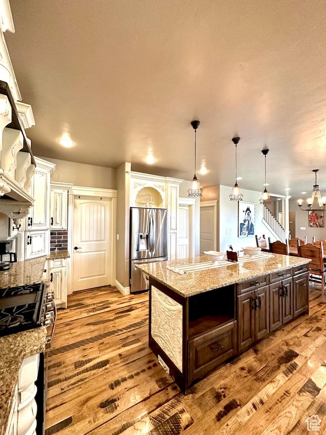 1471 N 3500 E, Ballard, UT 84066 - kitchen with appliances with stainless steel finishes, light wood-style floors, a chandelier, dark brown cabinets, and recessed lighting