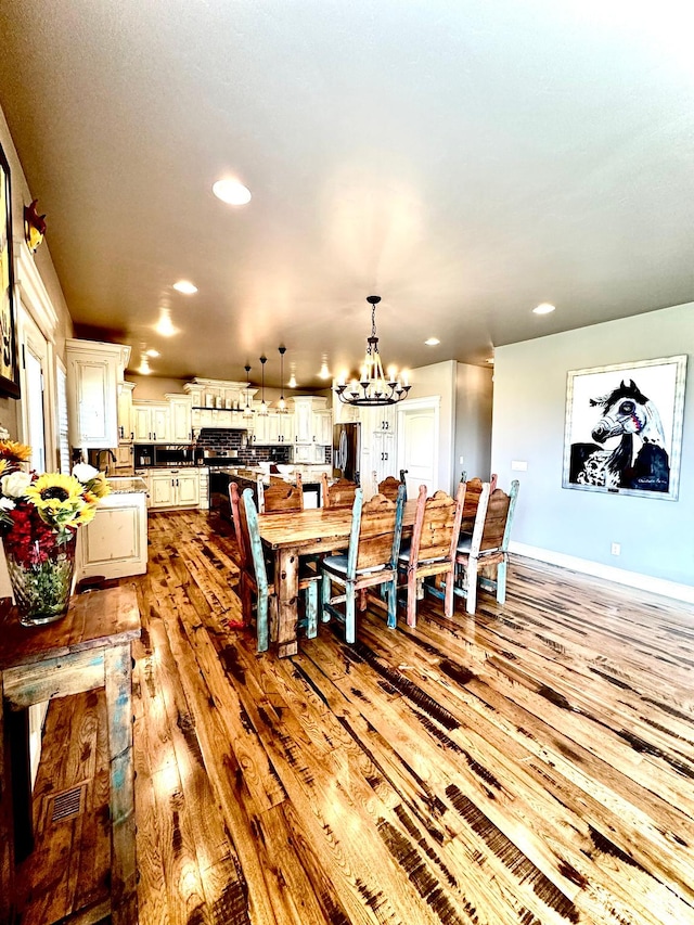 1471 N 3500 E, Ballard, UT 84066 - dining area featuring a chandelier, light wood finished floors, recessed lighting, and baseboards