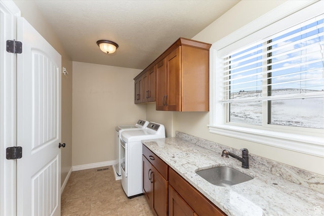 13695 Highlander Cir, Beaverdam, UT 84306 - washroom featuring washer and clothes dryer, cabinet space, and baseboards