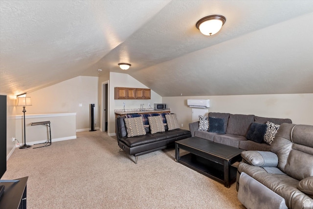 13695 Highlander Cir, Beaverdam, UT 84306 - living room with light colored carpet, vaulted ceiling, an AC wall unit, a textured ceiling, and baseboards