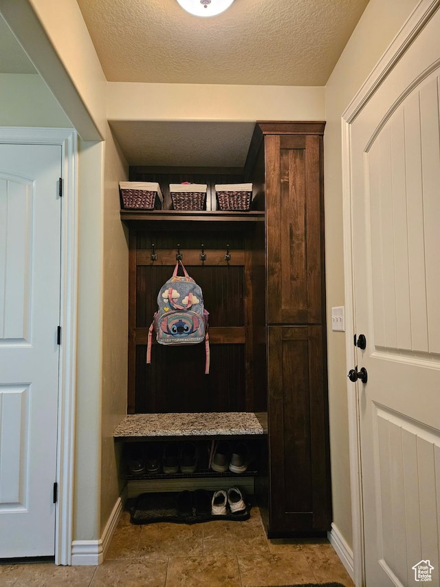 13695 Highlander Cir, Beaverdam, UT 84306 - mudroom featuring baseboards and a textured ceiling