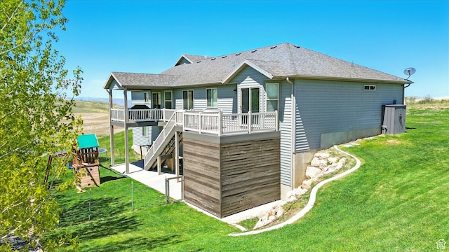 13695 Highlander Cir, Beaverdam, UT 84306 - rear view of house featuring a lawn, a deck, stairway, and a shingled roof