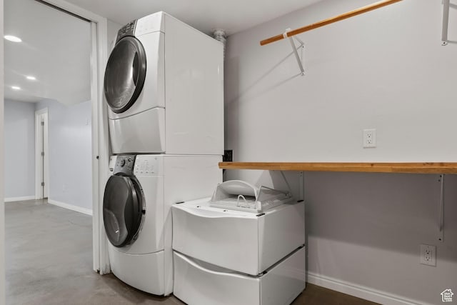 8793 S Mountain Vista Dr, West Jordan, UT 84081 - laundry room with estacked washer and dryer and baseboards