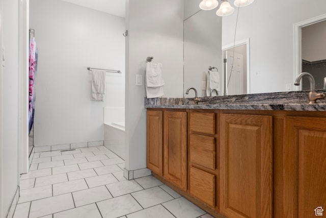 8793 S Mountain Vista Dr, West Jordan, UT 84081 - bathroom featuring double vanity, a garden tub, a spacious closet, and tile patterned flooring